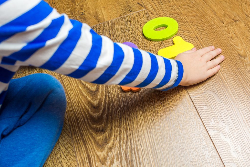 Young child playing happily with numbers